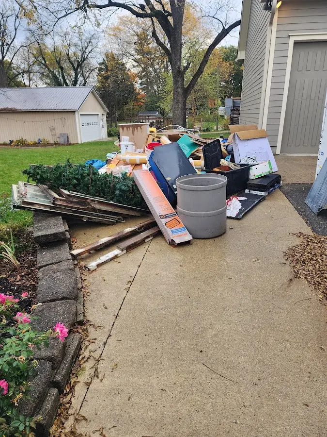 Dumpster being loaded with debris for Demolition Dumpster Rental in Whitesboro